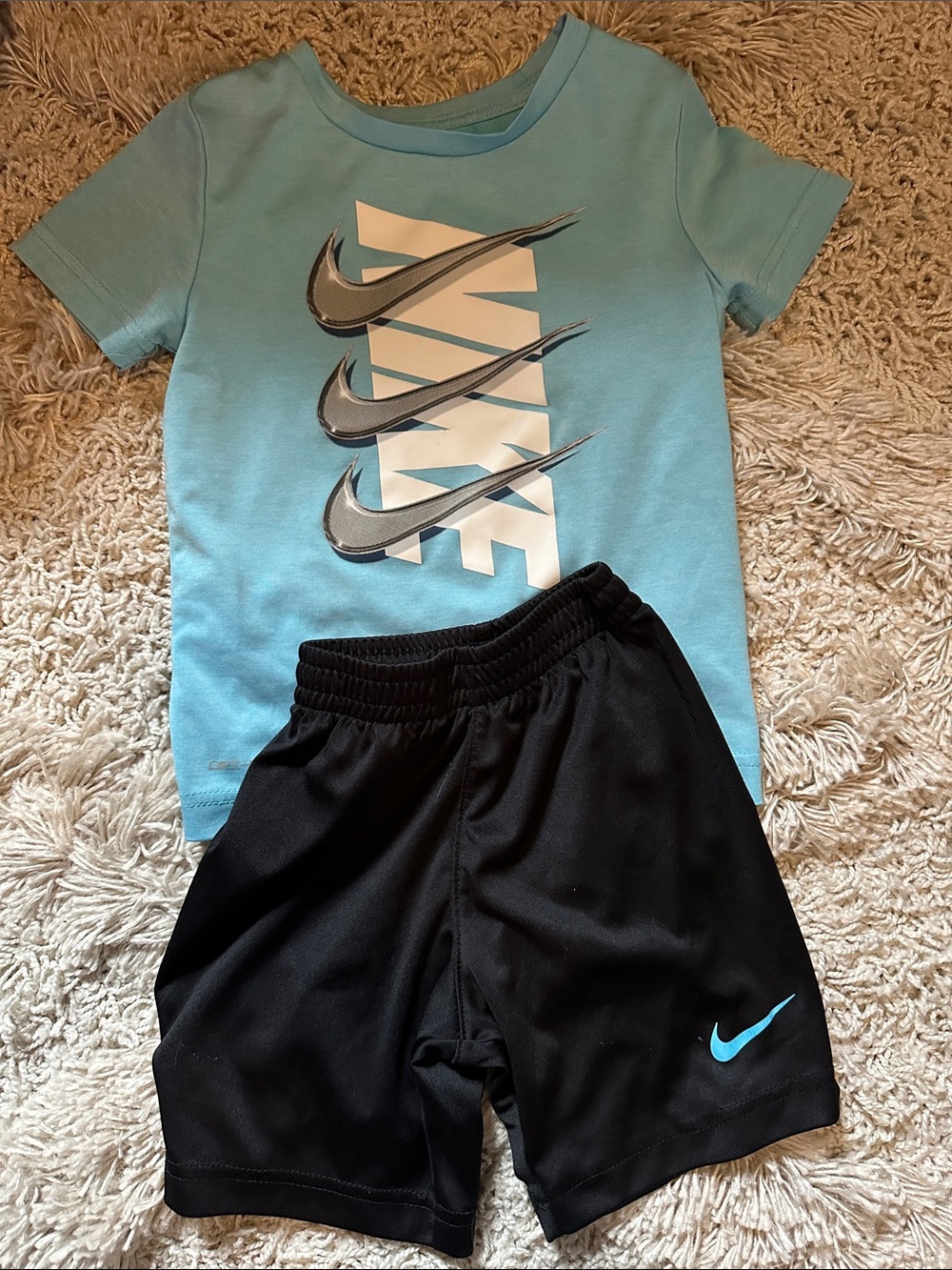 Nike Light Blue Graphic Tee with Black Shorts